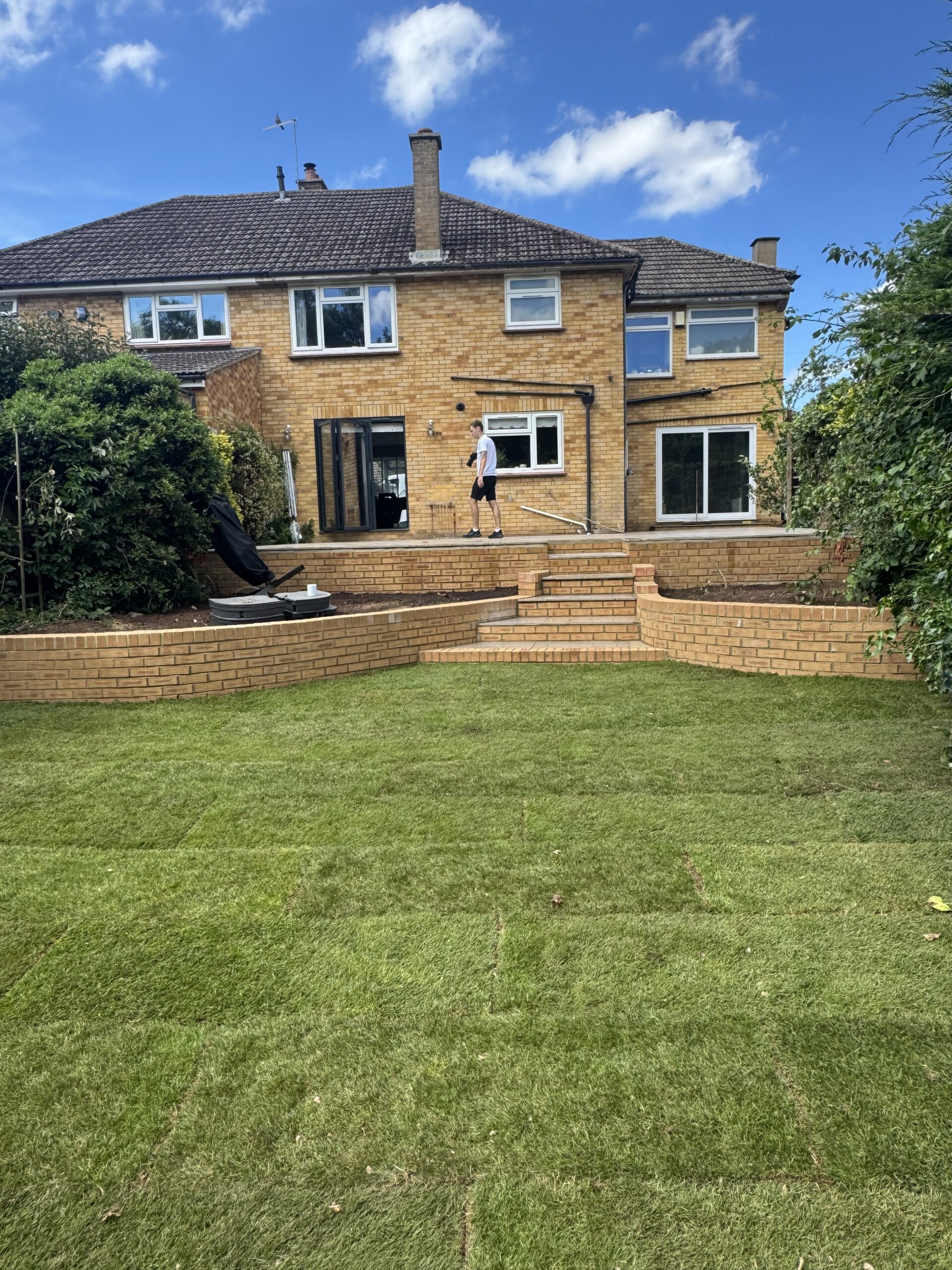 complete garden transformation, retaining walls, new grass and patio in bishops cleeve