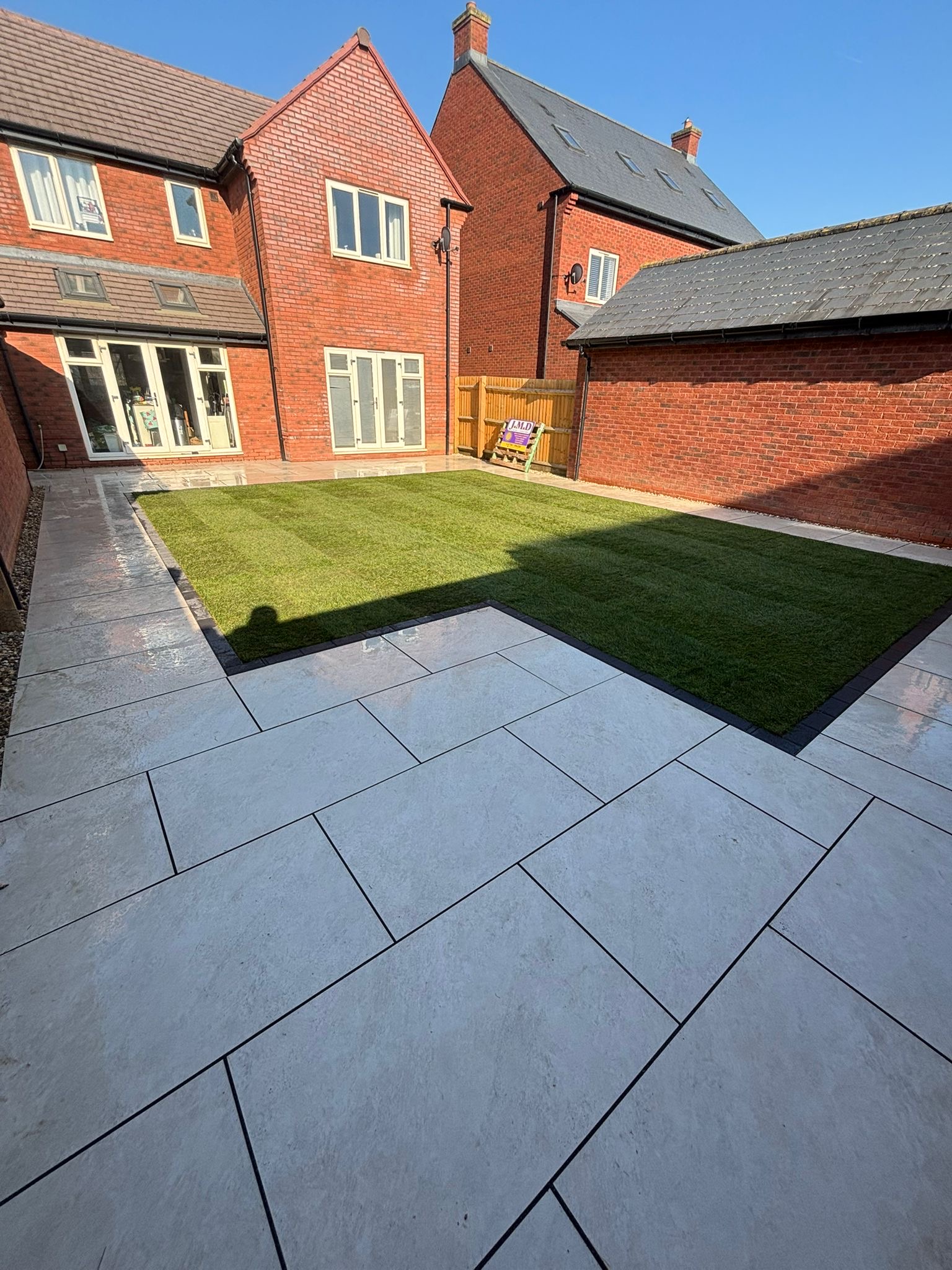 porcelain patio with fresh turf in hatherly