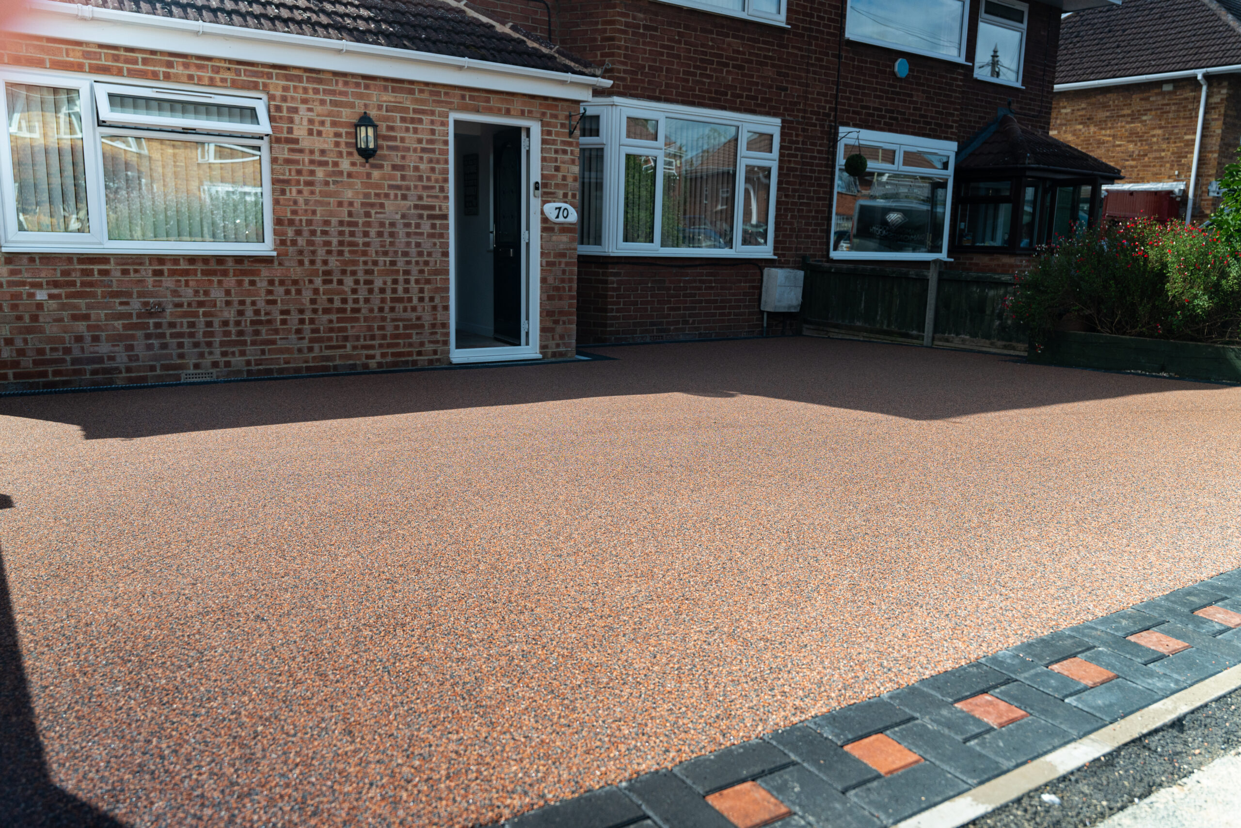 resin driveway with multi colour block paved border in cheltenham
